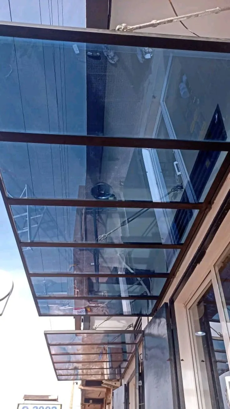 Blue tinted glass roof canopy over an entrance — BlueCrest, Egypt