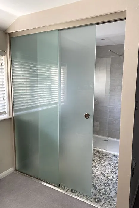 Frameless glass shower enclosure with hinged door — BlueCrest, Egypt